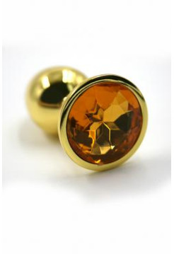 Золотая анальная пробка с ярко-оранжевым кристаллом (Small) Длина: 6 см. Диаметр: 2,8 см.